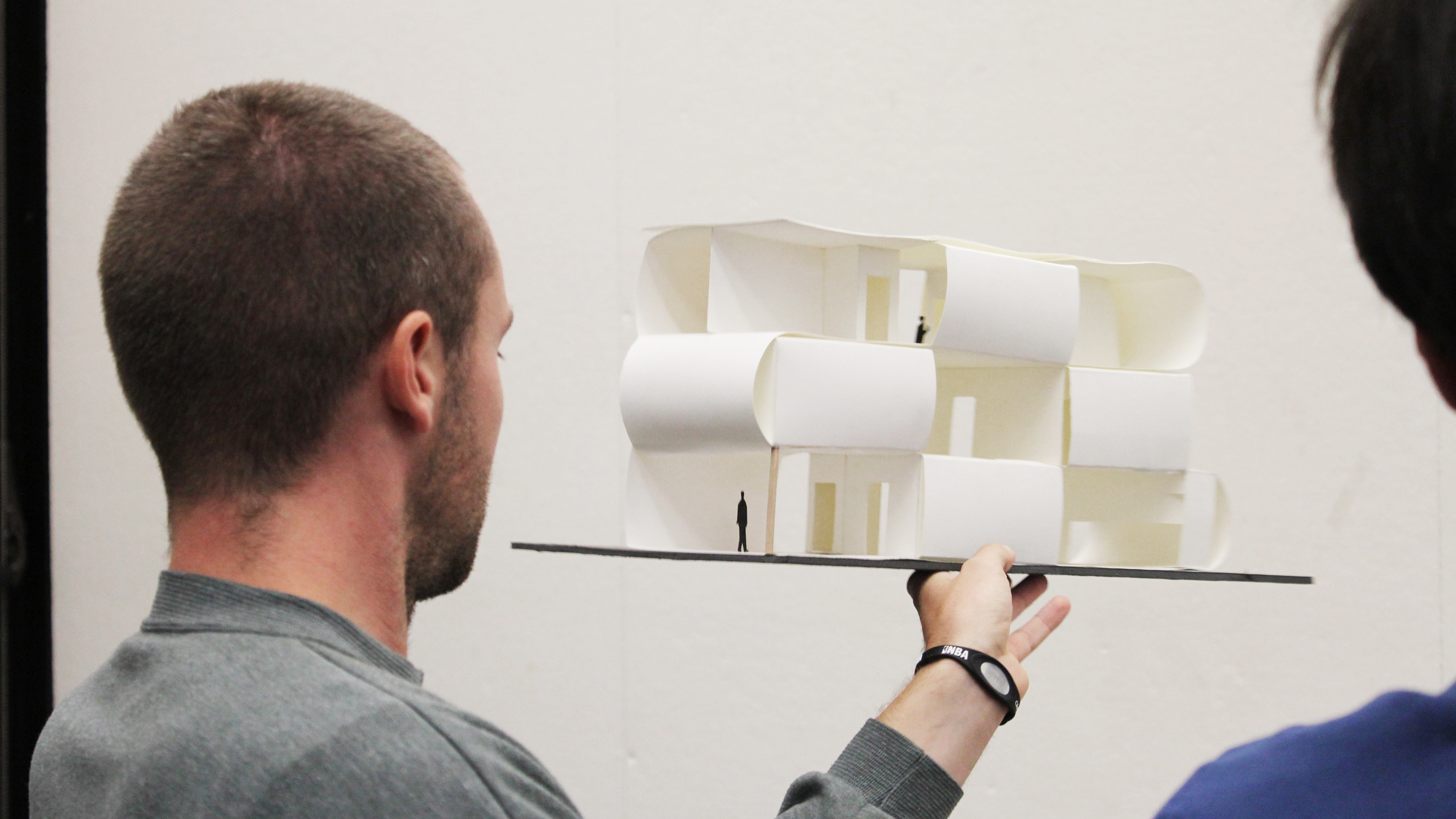 Guy holding architecture model
